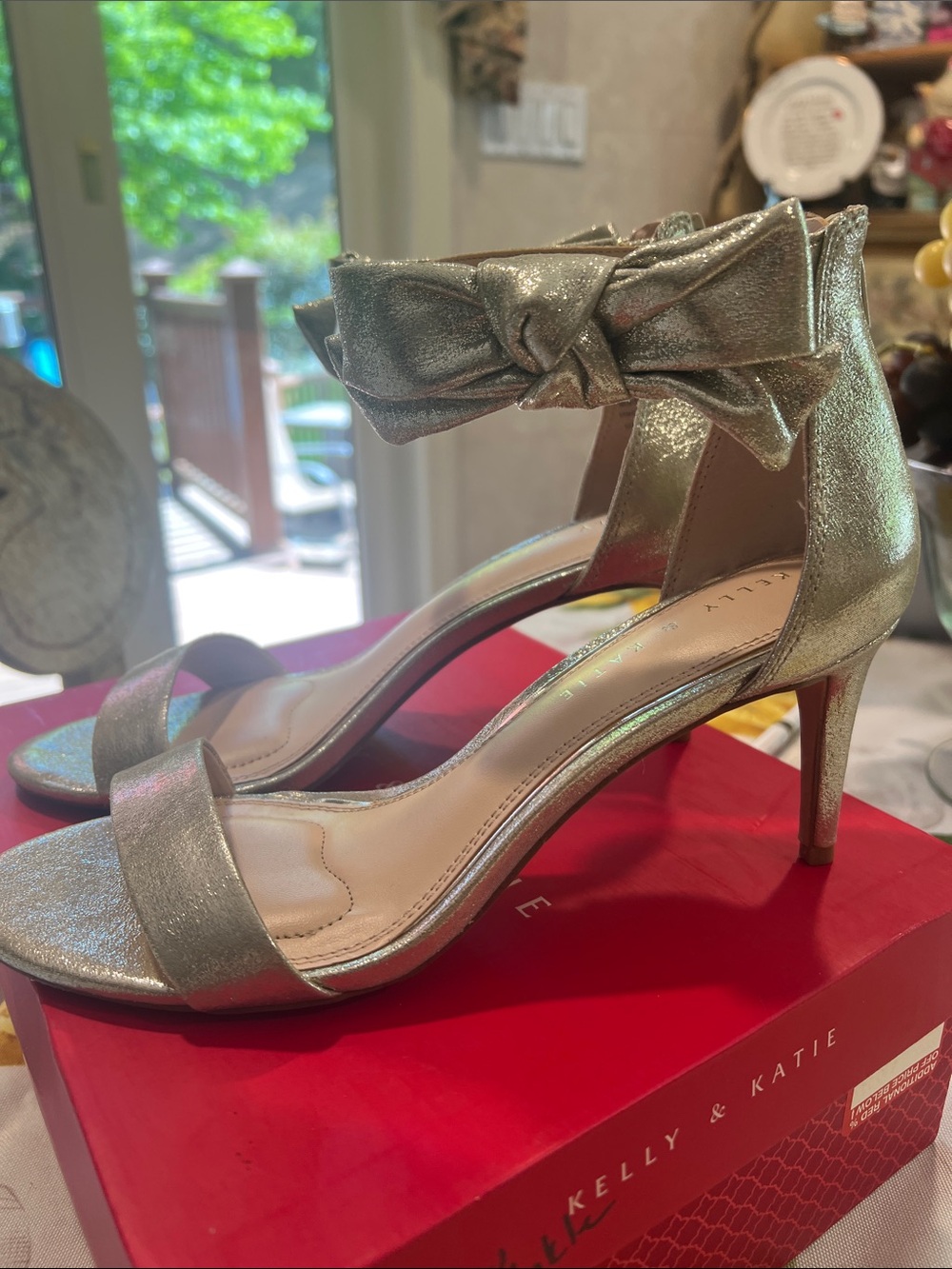 New, boxed, Kelly & Katie Metallic Gold Ankle-Tie Heels with bow.